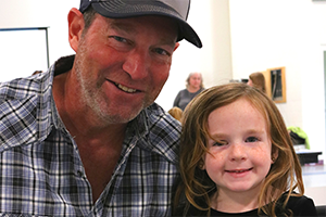 Father with daughter at Kindergarten event
